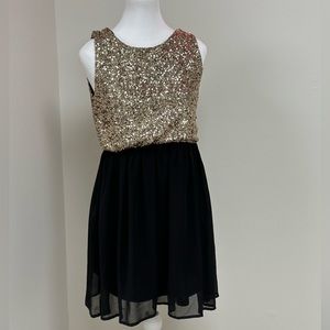 Like New Beautiful Black and Gold sequence dress.
